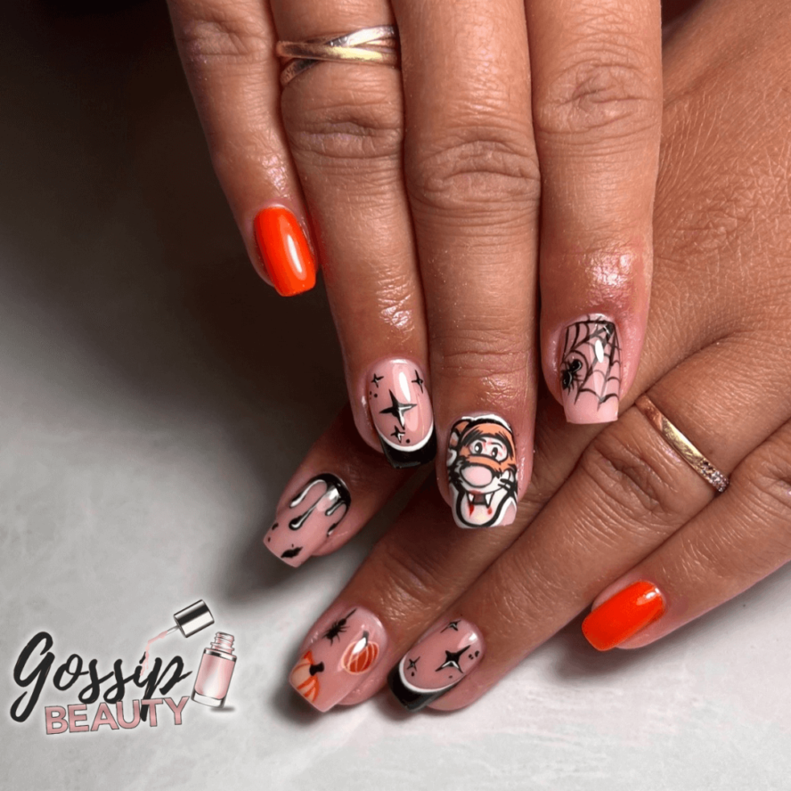 C'est une pose d'ongles en gel sur capsule avec nail art disney de Tigrou version Halloween réalisé à Poitiers dans l'institut Gossip Beauty